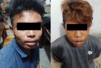 Foto, Dua tersangka saat diamankan di Polsek Pahandut