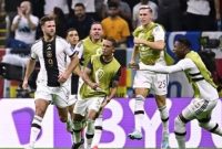 Para pemain Jerman merayakan gol #09 Niclas Fullkrug (kiri) merayakan dengan rekan setimnya pada pertandingan sepak bola Grup E Piala Dunia Qatar 2022 antara Spanyol dan Jerman di Stadion Al-Bayt di Al Khor, utara Doha pada 27 November 2022. JAVIER SORIANO / AFP/Suara.com