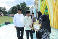Bupati Asahan H. Surya, BSc, saat pembukaan Musabaqah Tilawatil Qur'an (MTQ) ke-54 tingkat Kabupaten Asahan, di Desa Perkebunan Aek Tarum Kecamatan Bandar Pulau, Senin (27/02/2023). Foto:Irwan/1tulah.com

