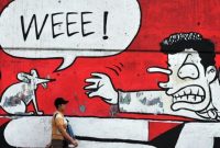 Grafiti yang menunjukkan dukungan terhadap gerakan antikorupsi pemerintah di Jakarta, 20 Juli 2010. (Foto: AFP/Bay ISMOYO)