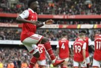 Winger Arsenal, Bukayo Saka merayakan golnya ke gawang Crystal Palace pada laga Liga Inggris di Stadion Emirates, London, Minggu (19/3/2023) malam WIB. [J TALLIS / AFP]
