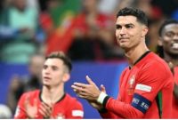 Penyerang timnas Portugal, Cristiano Ronaldo melakukan selebrasi setelah memenangkan pertandingan babak 16 besar Euro 2024 antara Portugal vs Slovenia di Frankfurt Arena di Frankfurt am Main pada 1 Juli 2024. PATRICIA DE MELO MOREIRA / AFP.