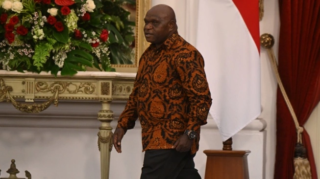 Menteri HAM Natalius Pigai di Istana Kepresidenan Jakarta. (sumber: suara.com)