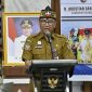 Plt. Sekda yang juga Kepala BAPPERIDA Prov. Kalteng Leonard S. Ampung saat menyampaikan Sambutan Sekaligus Membuka Acara