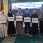 Kapolres Barut AKBP Singgih Febiyanto beserta Ketua Bhayangkari Cabang Barut Fidya Singgih, Ketua PWI H Deni Hariadi dan sejumlah pejabat utana foto bersama usai menyerahkan santunan kepada anak panti asuh dalam acara buka puasa bersama di Aula Polres Barut, Kamis, 5 Maret 2026. Foto: Aprie/1tulah.com