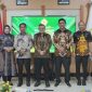 Foto Penyerahan laporan yang dilaksanakan di Palangkaraya